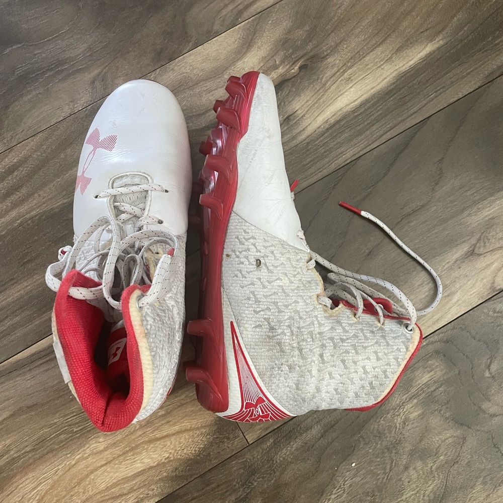 Under Armour, ladies lacrosse cleats, size 8, red and white gently used.